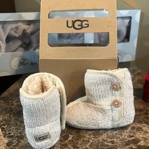 Cream colored baby Uggs. Baby size 2/3 Velcro closing.